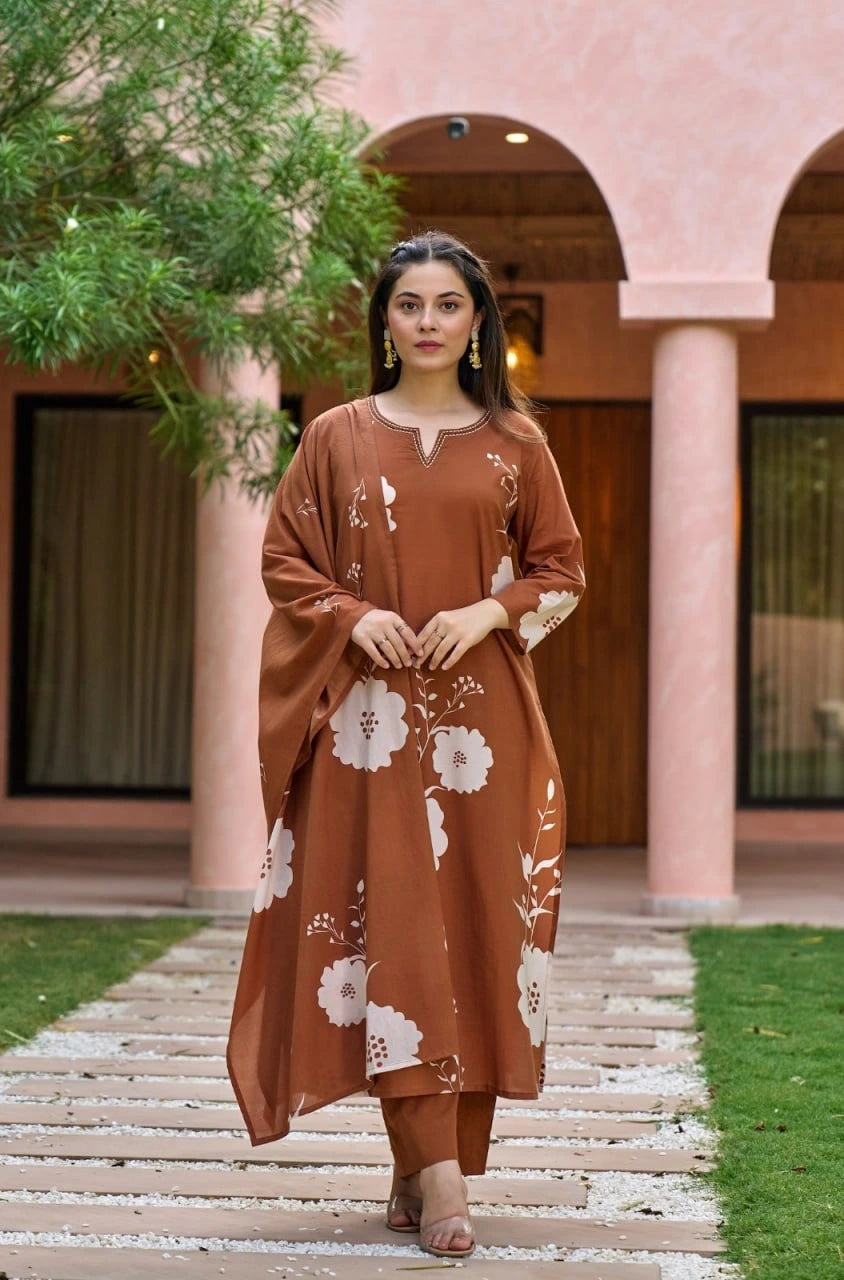 A front-facing shot where the woman is holding her dupatta with both hands. The image emphasizes the intricate white embroidery around the V-shaped neckline and the soft texture of the fabric.